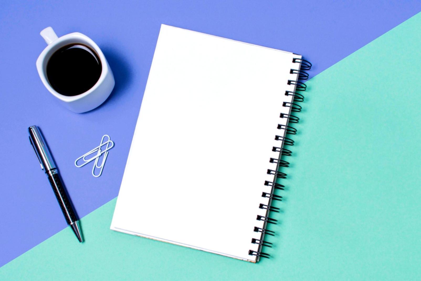 Financial planning session with documents and analysis tools spread across a workspace